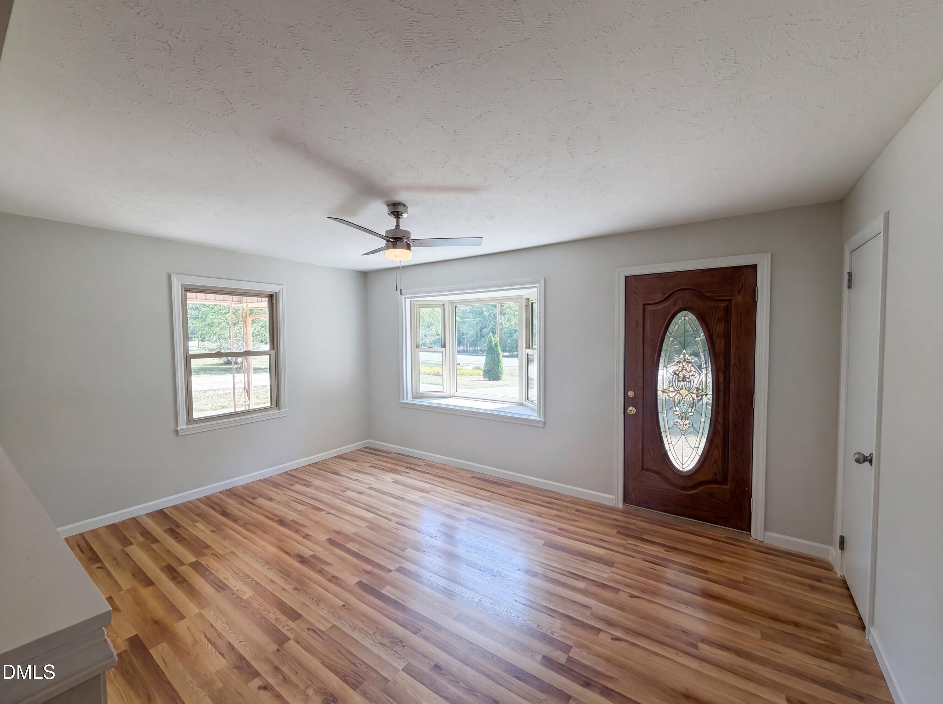 1710 West B Street Butner, NC 27509 - Photo 2 of 14 a view of a room with wooden floor and window