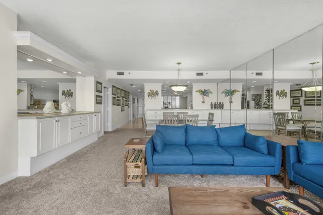 a kitchen with kitchen island granite countertop a table and chairs in it