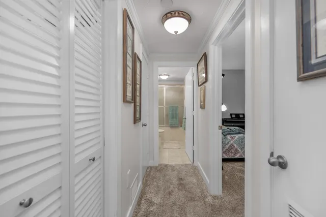 a living room with furniture and a book shelf