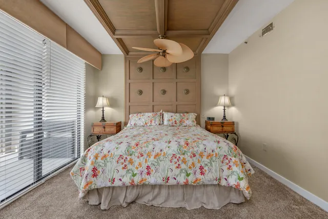 a view of walk in closet with clothes