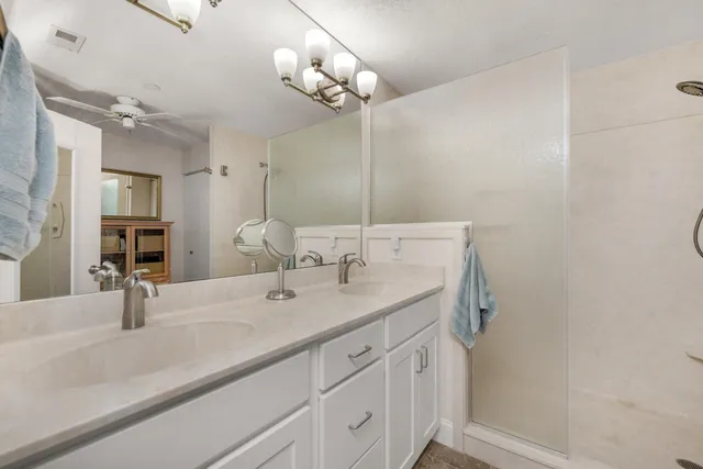 a view of a chairs and table in a balcony
