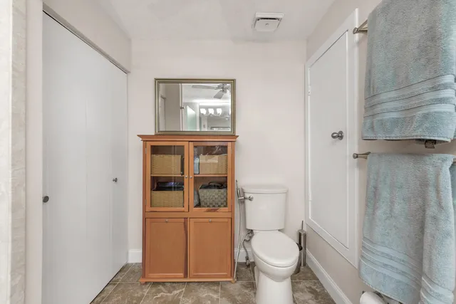 a view of a chairs and table in a balcony