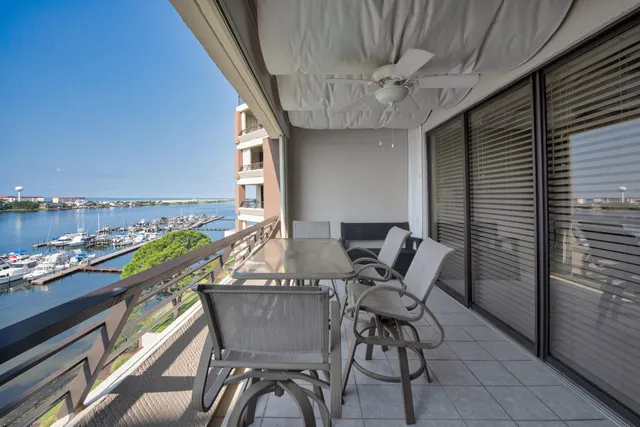 a view of a lake with houses in the back