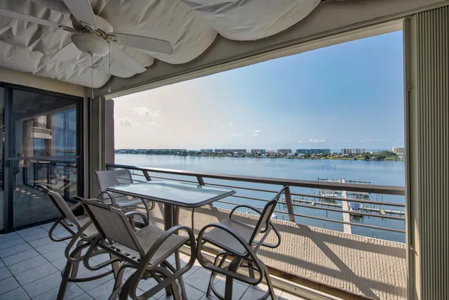 a view of a swimming pool with a table and chairs