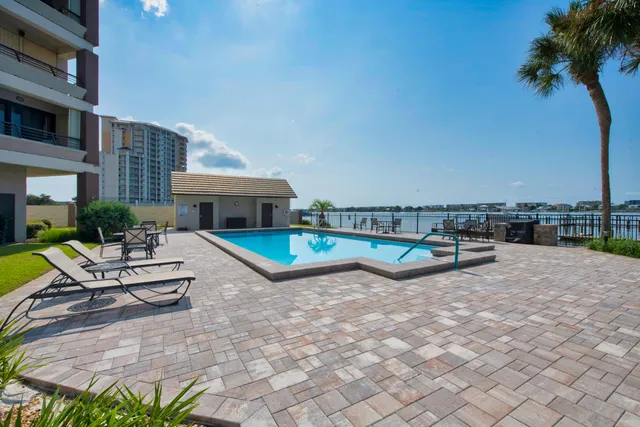 a view of swimming pool with outdoor seating and yard