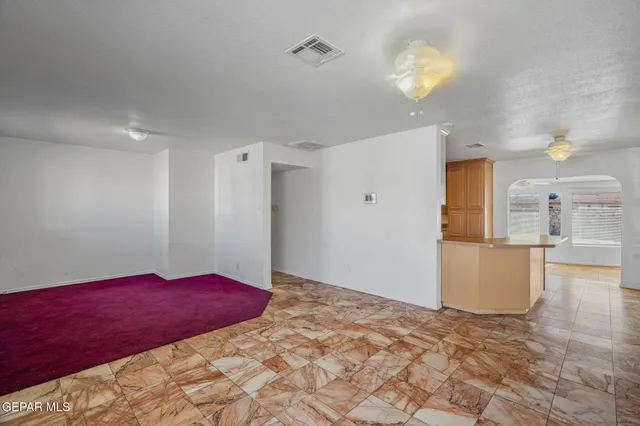 a kitchen with stainless steel appliances a refrigerator and cabinets