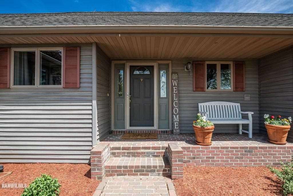 10143 South Massbach Road Elizabeth, IL 61028 - Photo 3 of 43 a front view of a house with outdoor seating