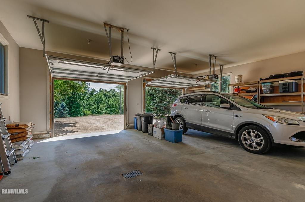 10143 South Massbach Road Elizabeth, IL 61028 - Photo 34 of 43 a view of a garage and car parked