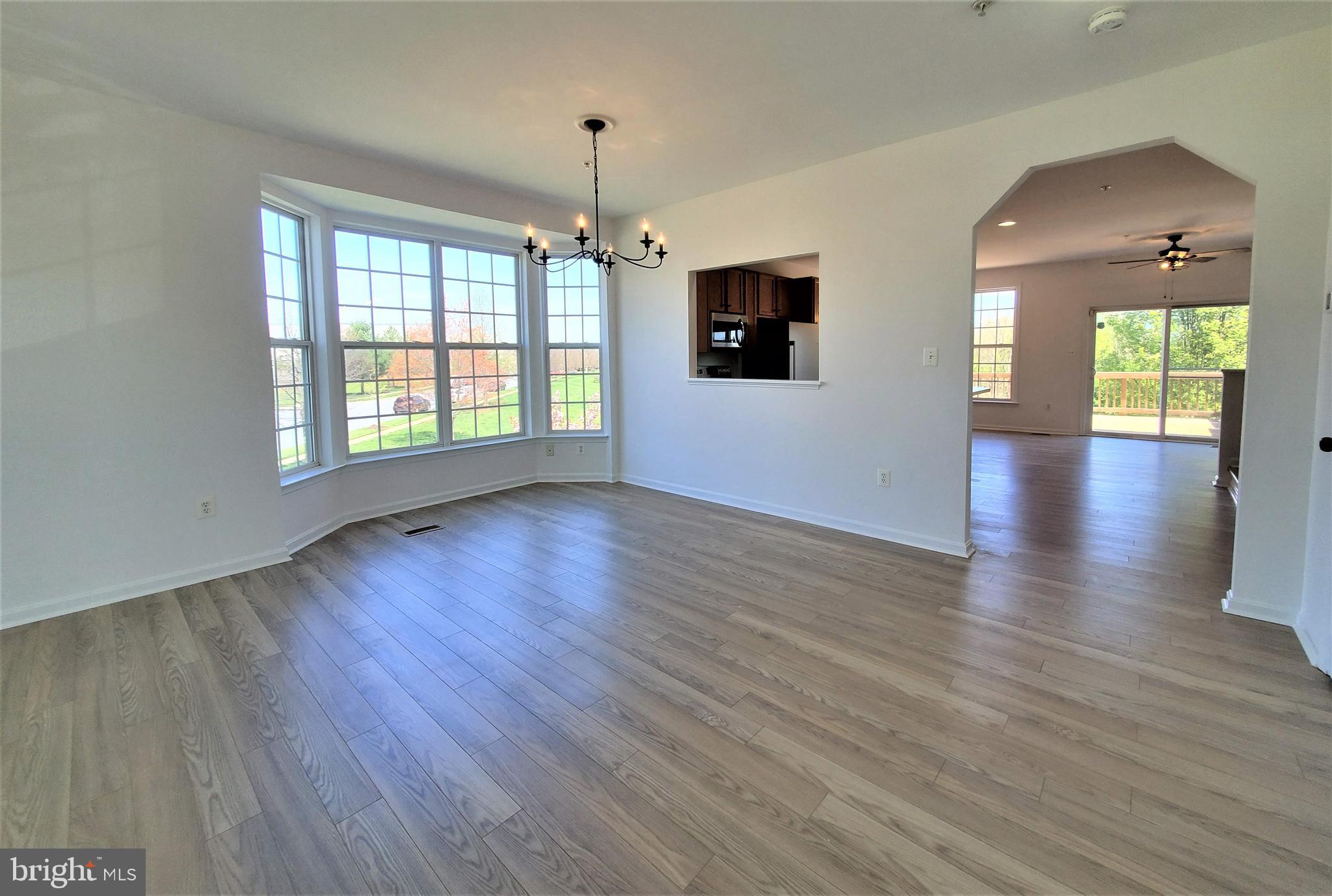 200 Timber View Court Frederick, MD 21702 - Photo 6 of 54 Arched opening into kitchen