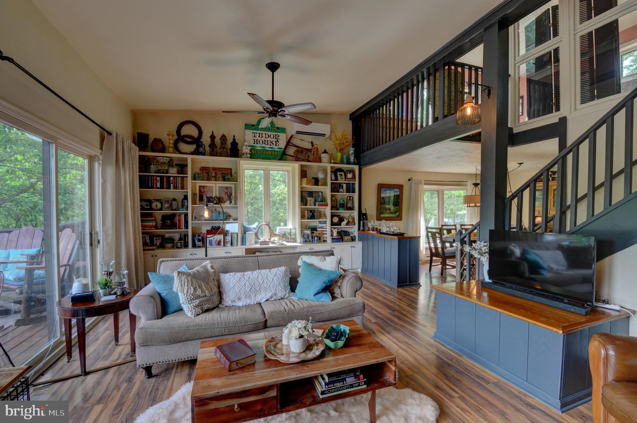 936 Reynolds Road Cross Junction, VA 22625 - Photo 29 of 76 Living room with full windows and door to the deck