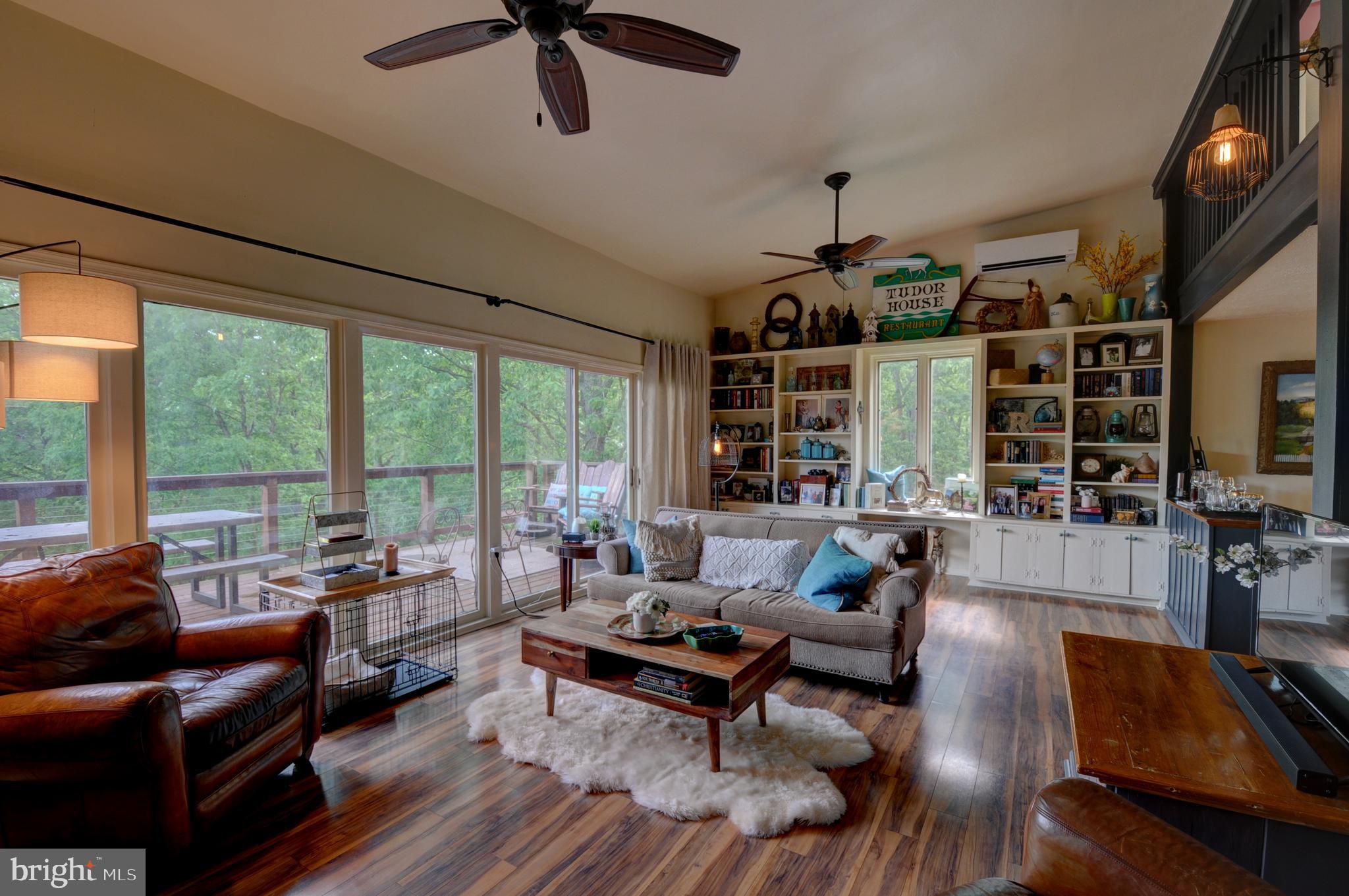 936 Reynolds Road Cross Junction, VA 22625 - Photo 30 of 76 Living room with full windows and door to the deck