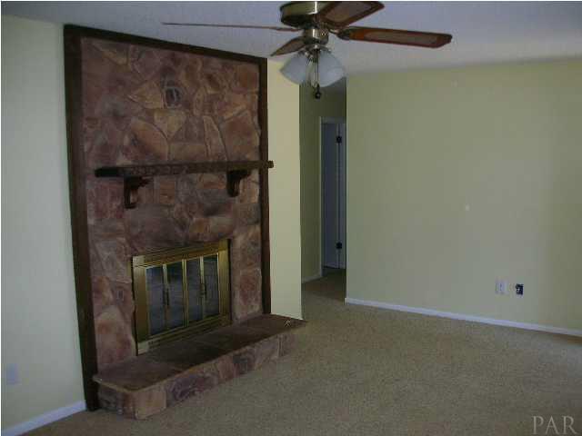 2966 Ranchette Square Gulf Breeze, FL 32563 - Photo 3 of 7 Spacious living room with rock fireplace