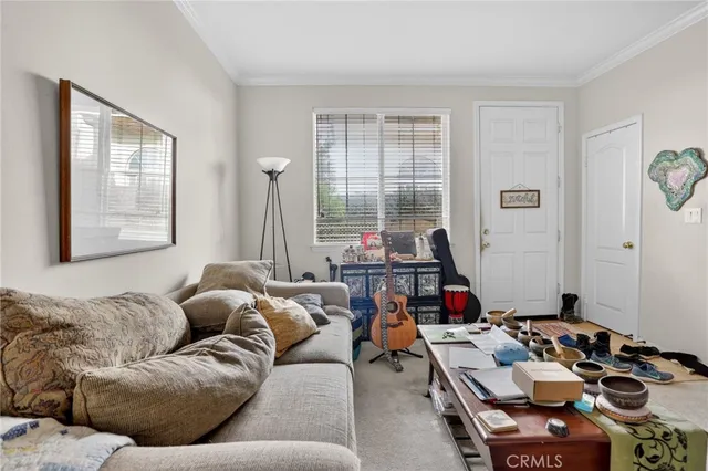 a kitchen with sink a window and cabinets