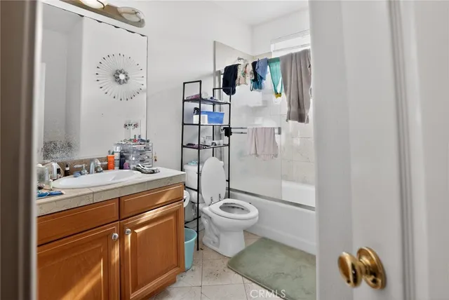 a bathroom with a tub and sink