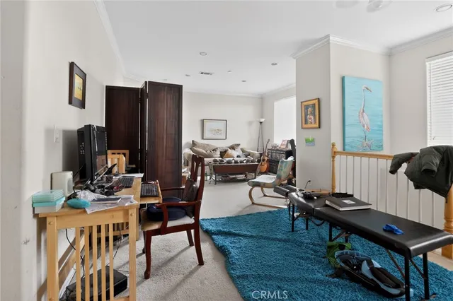 a view of a livingroom with furniture and a rug