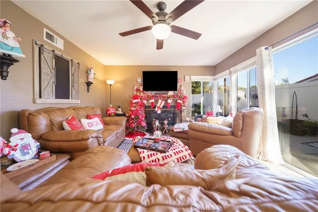a living room with furniture and flowers