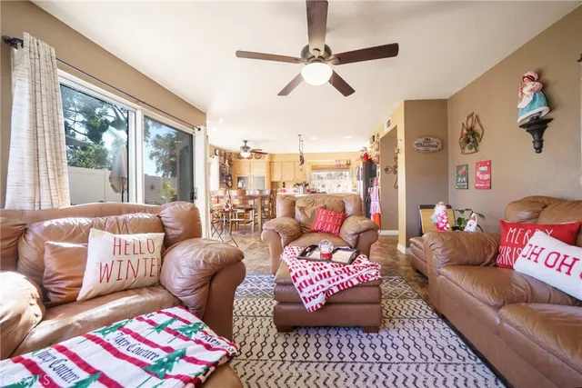 a kitchen with stainless steel appliances a stove a sink a oven a dining table and chairs