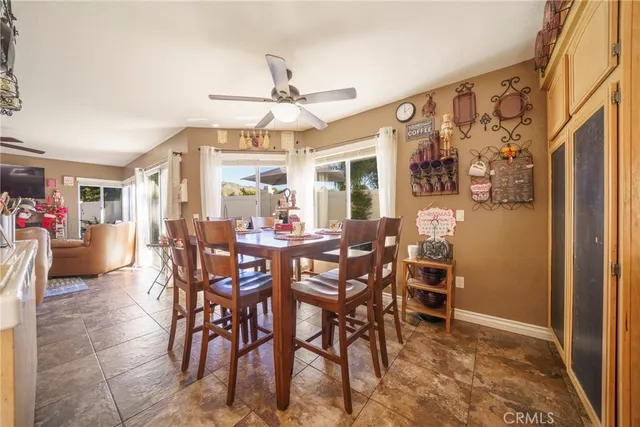 a spacious bedroom with a bed and a chandelier