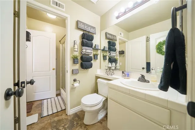 a bathroom with a glass shower door