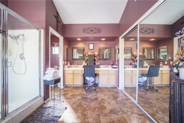a view of a patio with a dining table and chairs under an umbrella