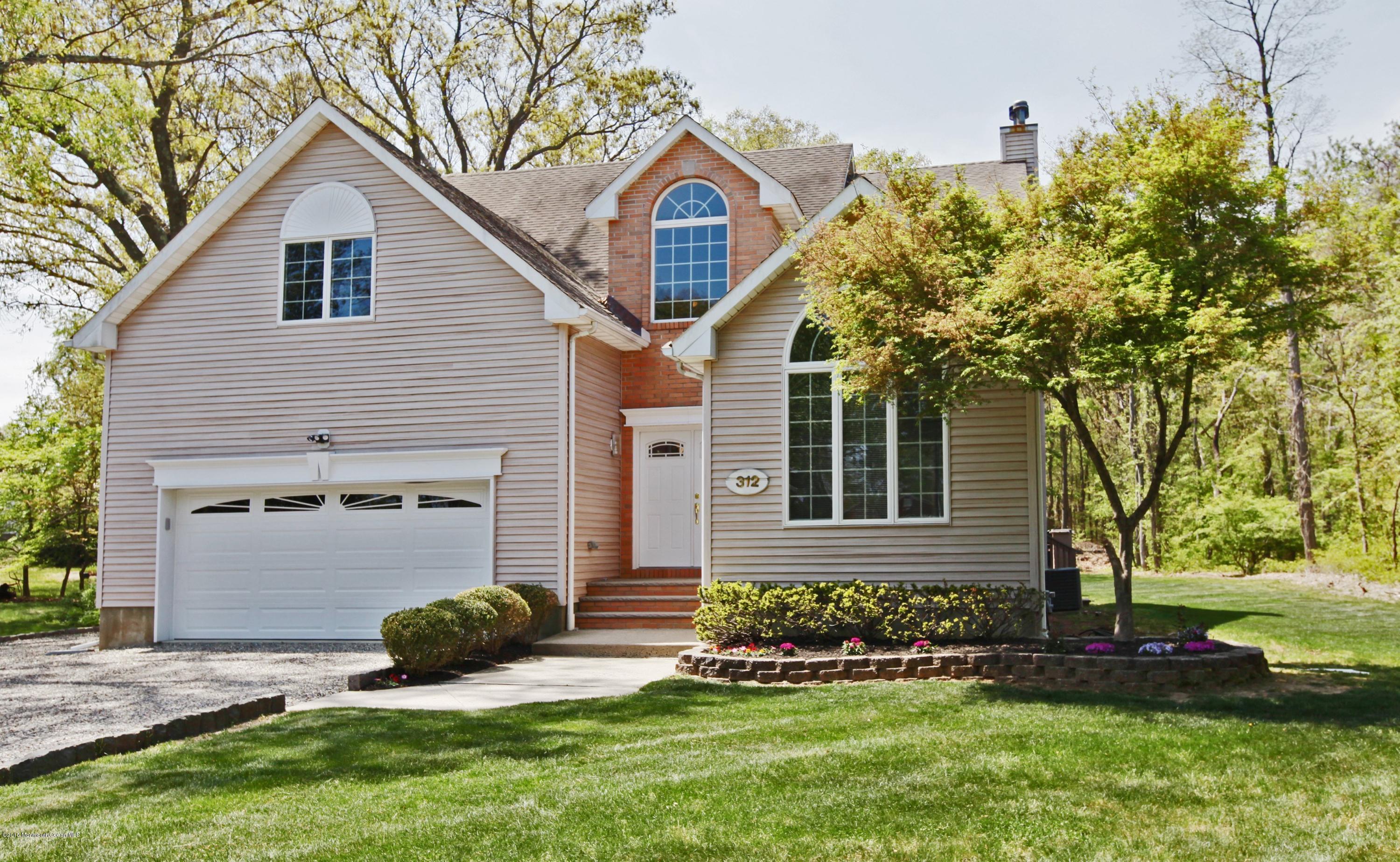 312 Hockhockson Road Tinton Falls, NJ 07724 - Photo 1 of 14 Front of House