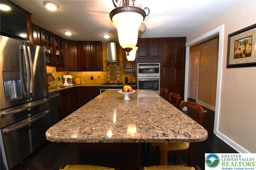 424 Grape Street Whitehall, PA 18052 - Photo 23 of 56 This spacious kitchen offers a large island with ample counter space for culinary endeavors.