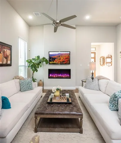 a living room with furniture and a rug