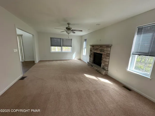 a kitchen with stainless steel appliances granite countertop a refrigerator a sink and a stove