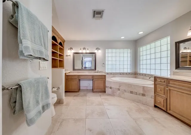 a view of walk in closet with clothes