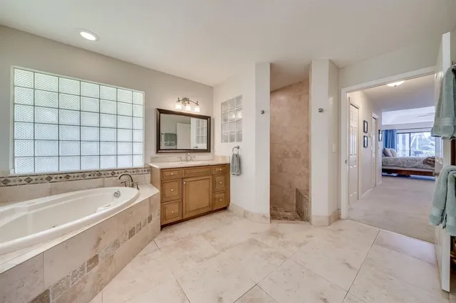 a view of a livingroom with workspace and a window