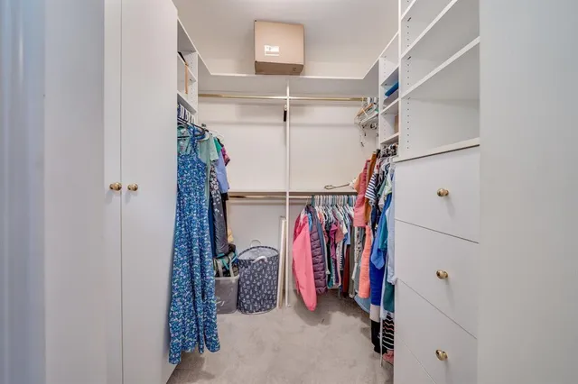 a bathroom with a granite countertop sink a toilet and a mirror