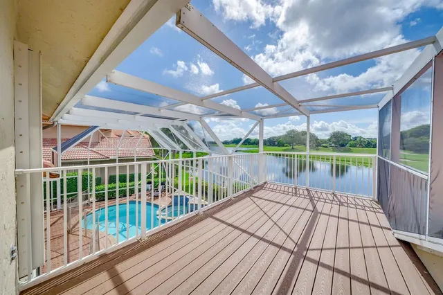 a view of a swimming pool with a patio