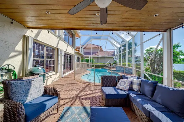a view of a house with backyard porch and wooden floor