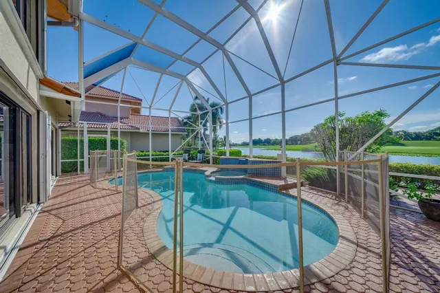 a view of a lake with a house in the background