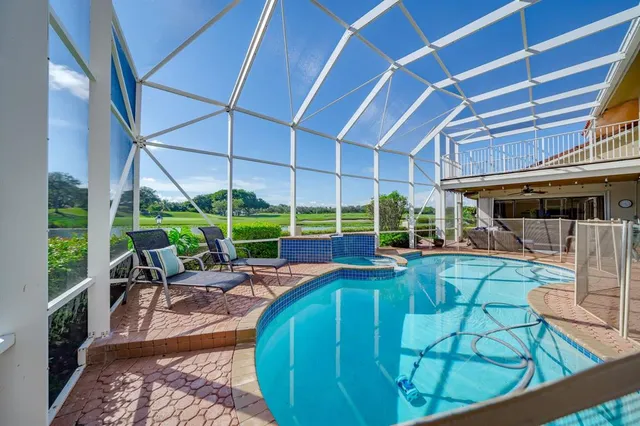 an aerial view of a residential houses with outdoor space