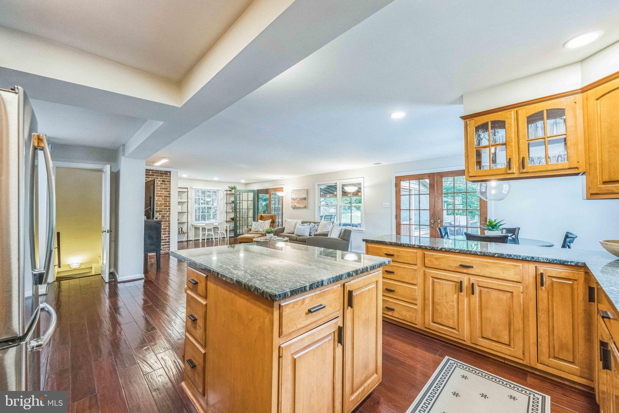 727 Hemlock Road Media, PA 19063 - Photo 13 of 37 a kitchen with stainless steel appliances granite countertop a sink a stove and a wooden floors