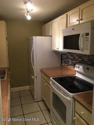 a kitchen with a stove and a microwave