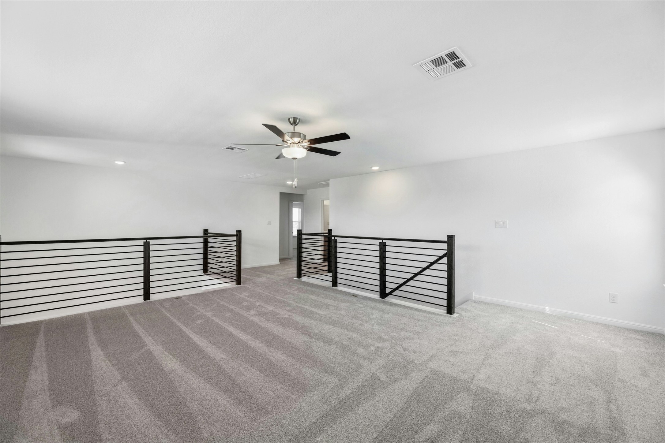 2001 Wynn Road Hutto, TX 78634 - Photo 26 of 39 A spacious, naturally illuminated loft provides versatile living space and a contemporary feel.