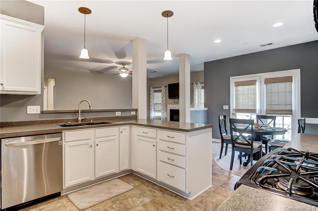 79297 Ridgehaven Road Lancaster, SC 29720 - Photo 13 of 36 a kitchen with white cabinets and sink