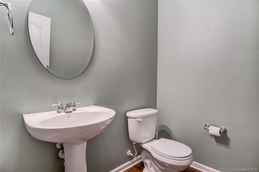 79297 Ridgehaven Road Lancaster, SC 29720 - Photo 20 of 36 a bathroom with a toilet a sink and a mirror
