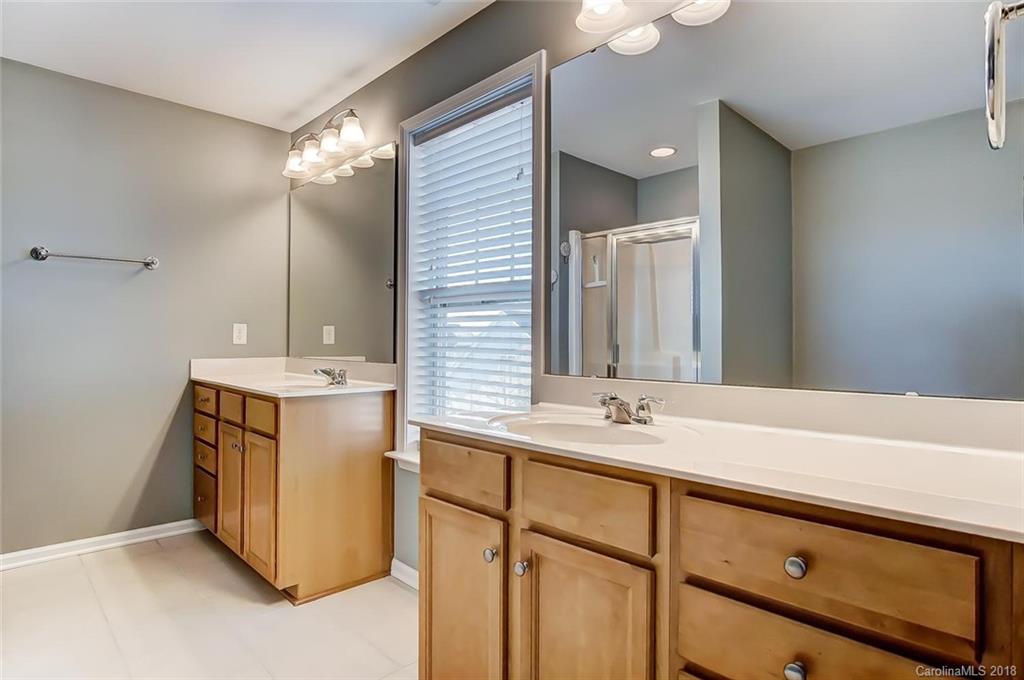 79297 Ridgehaven Road Lancaster, SC 29720 - Photo 26 of 36 a bathroom with a sink vanity and mirror