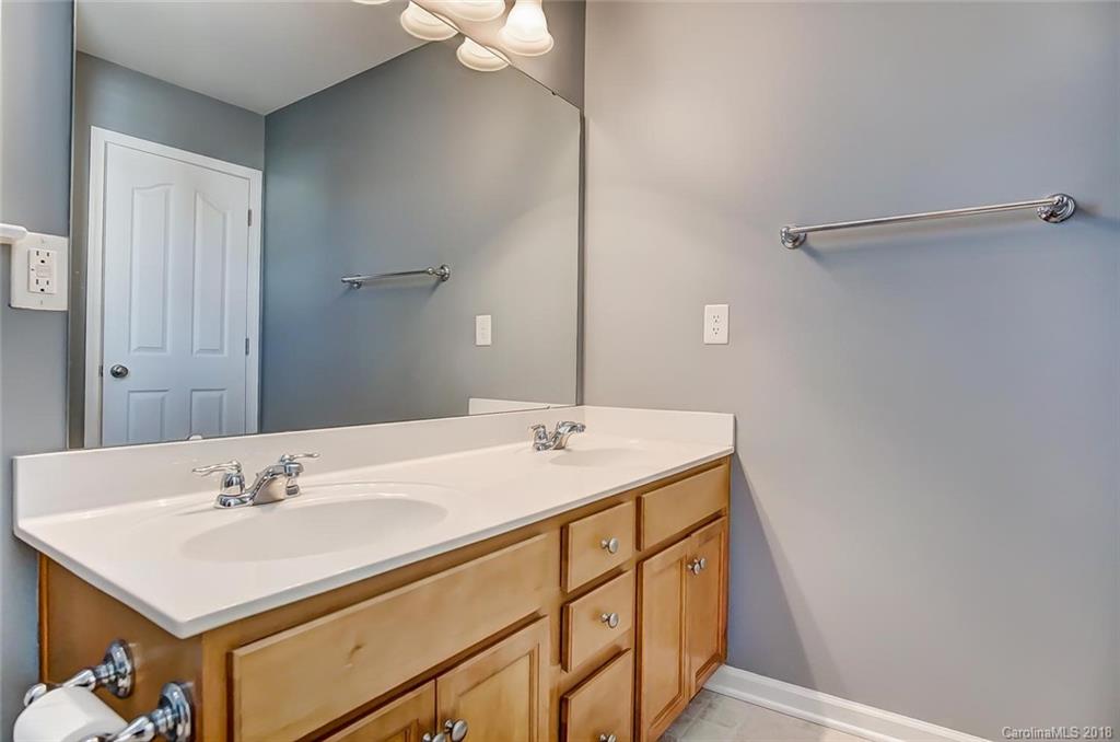 79297 Ridgehaven Road Lancaster, SC 29720 - Photo 29 of 36 a bathroom with a sink and a mirror