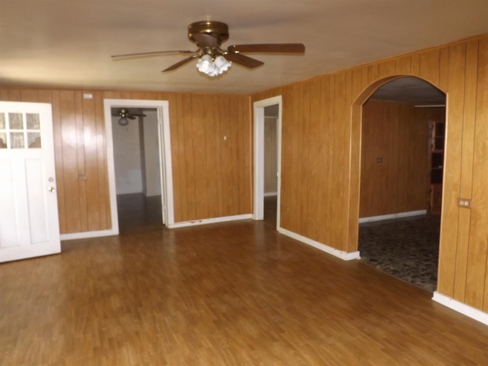 2041 Jackson Hollow Road Goodspring, TN 38460 - Photo 8 of 30 a view of an empty room with wooden floor and a window