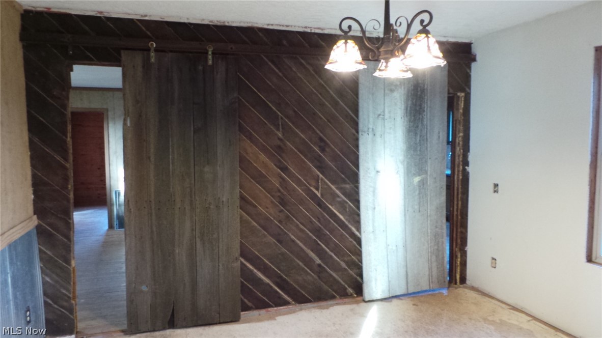 2055 Buffalo Run Road Rockport, WV 26169 - Photo 14 of 20 I love what they did with the barn doors to the sitting bonus room on the Left and the Kitchen on the Right.