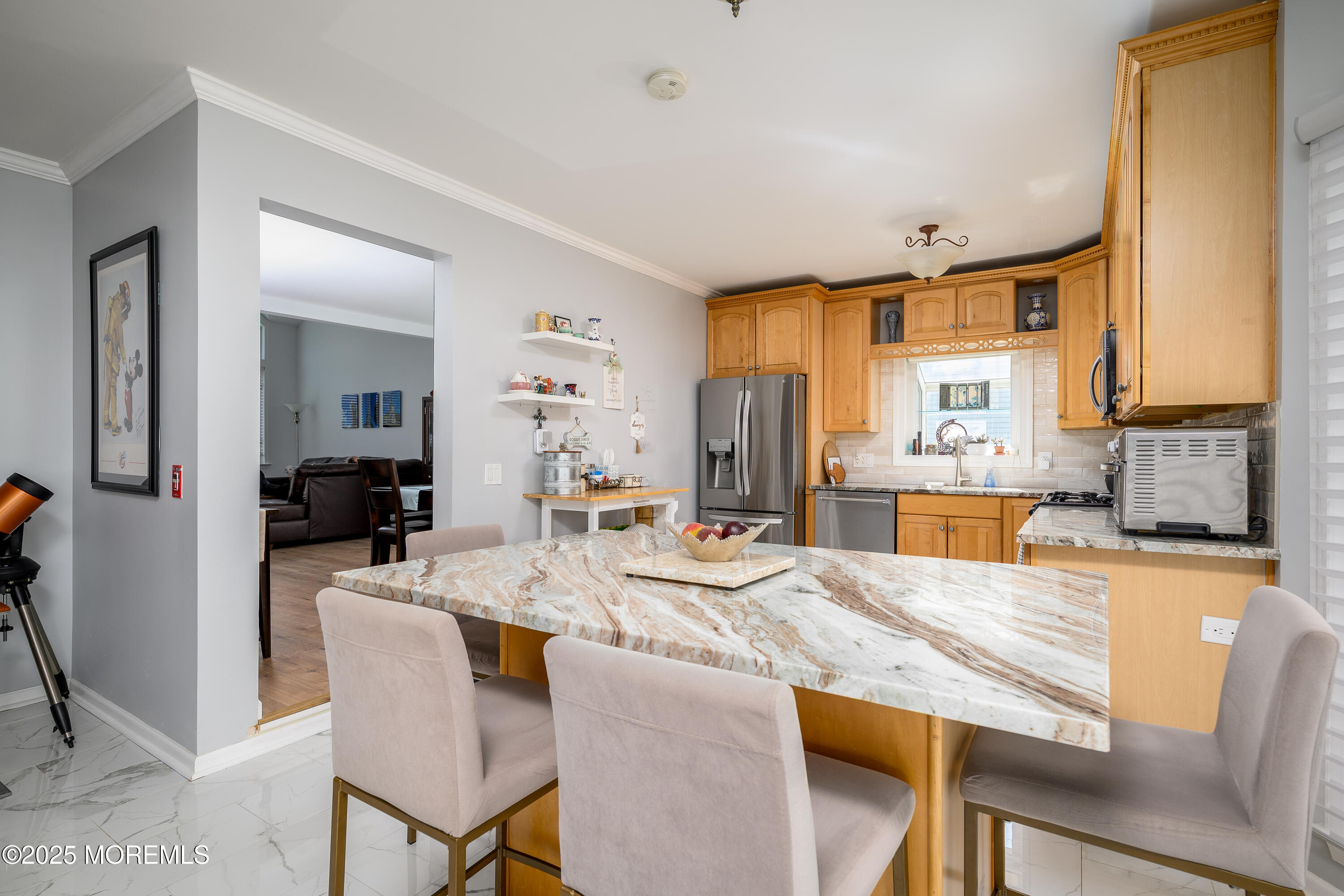 32 Sweet Gum Road Howell, NJ 07731 - Photo 4 of 42 a dining hall with stainless steel appliances kitchen island granite countertop a dining table and chairs