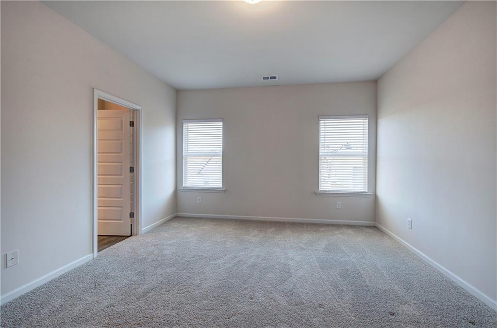 509 Alma Street Cartersville, GA 30121 - Photo 21 of 39 an empty room with windows