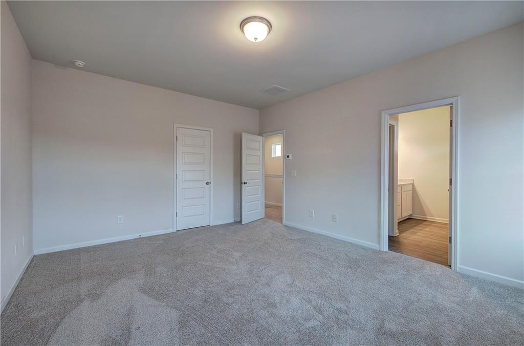 509 Alma Street Cartersville, GA 30121 - Photo 22 of 39 an empty room with an empty space and windows