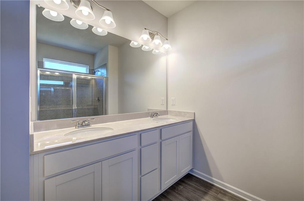 509 Alma Street Cartersville, GA 30121 - Photo 28 of 39 a bathroom with a sink and a mirror