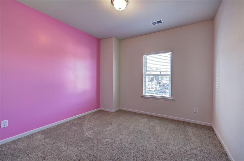 509 Alma Street Cartersville, GA 30121 - Photo 31 of 39 an empty room with a window