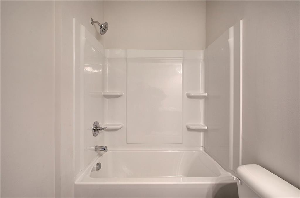 509 Alma Street Cartersville, GA 30121 - Photo 33 of 39 a white bath tub sitting next to a white toilet